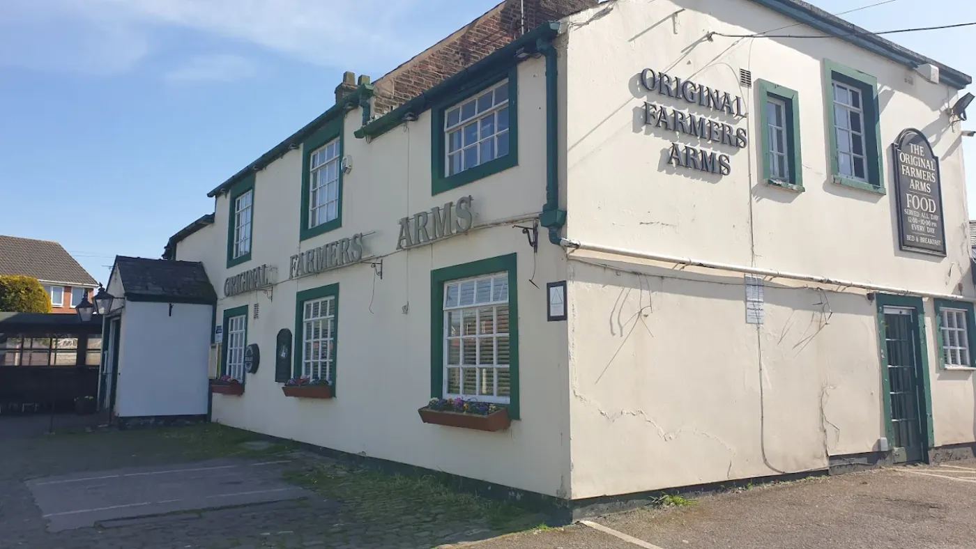 Corner view showing pub signage and window boxes